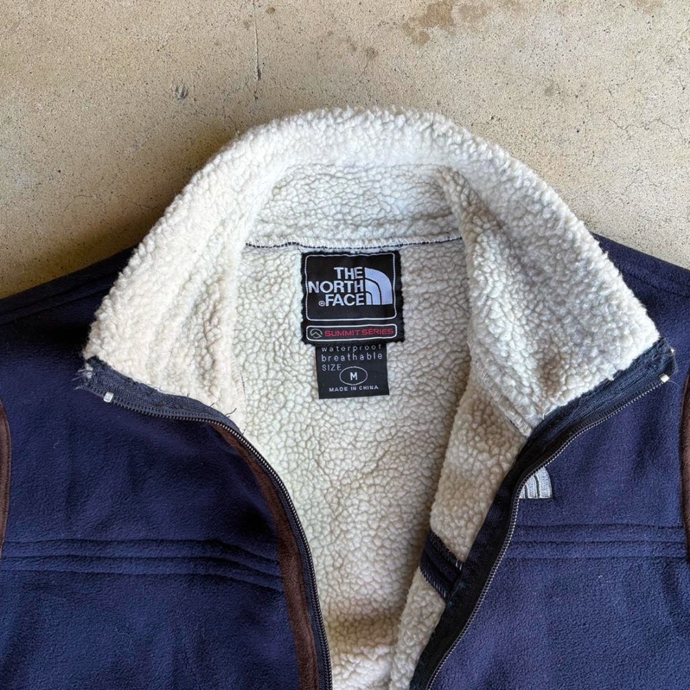 90s north face blue and white with brown accents vest